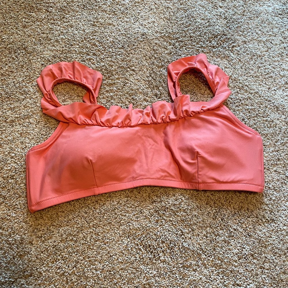 Salmon-colored ruffle bikini top